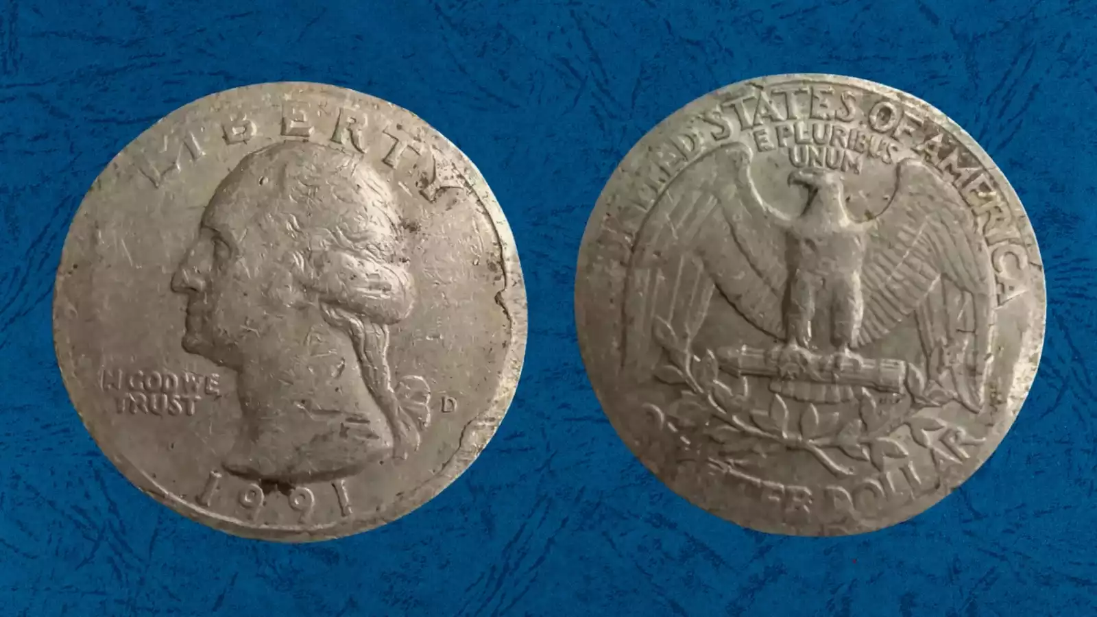 1991 Washington Quarter broadstrike error showing expanded rimless coin spread beyond normal collar diameter