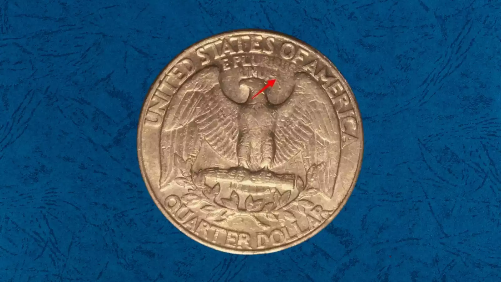 1991 Washington Quarter struck-through error showing incuse impression from trapped grease or debris on Washington's portrait